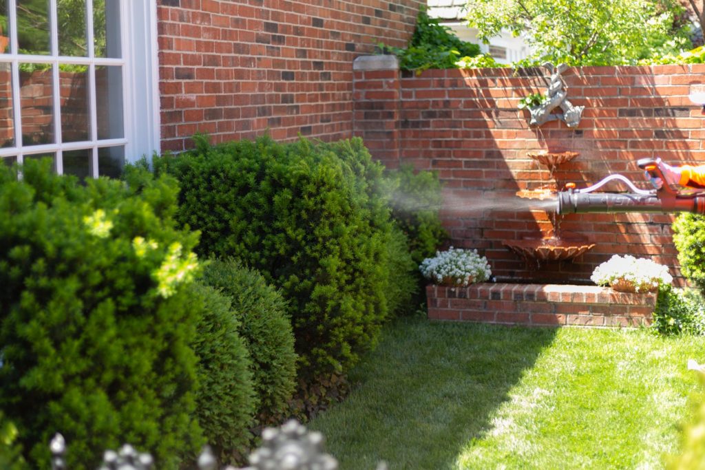 A member of our team uses a specialized device to perform HOA insect control in Mission Hills