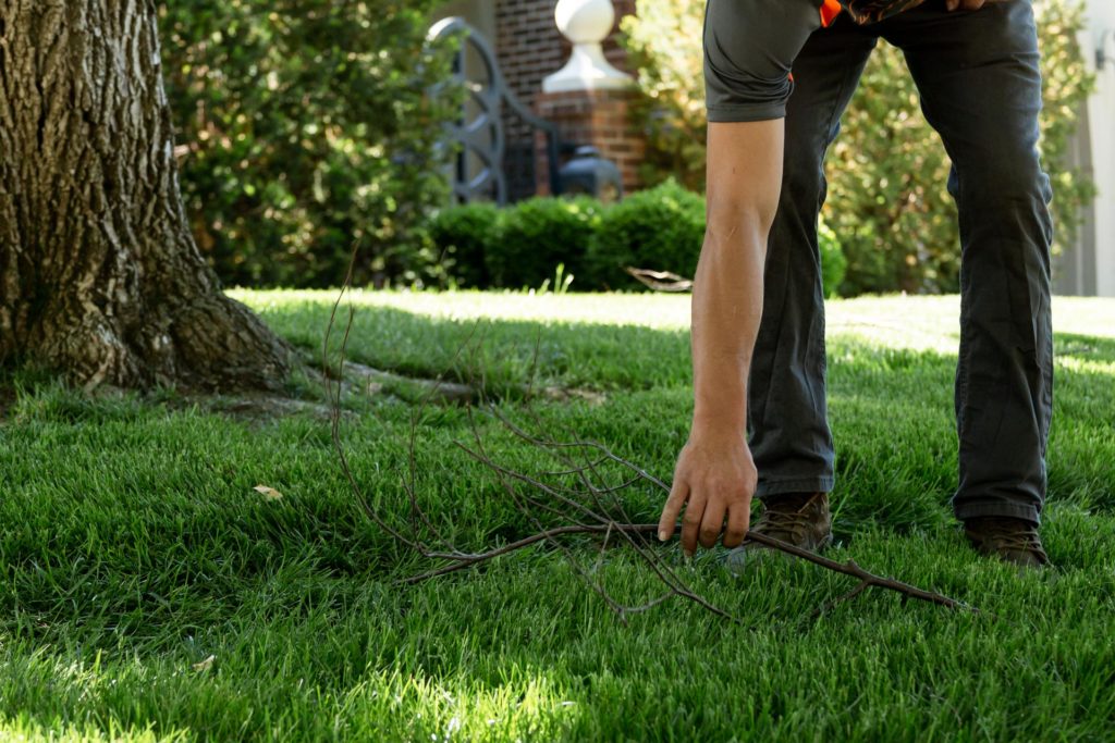A man performs HOA yard waste disposal in Overland Park